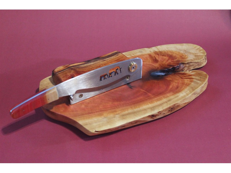 Biltong cutter with a stainless steel blade mounted on Red Ivory board